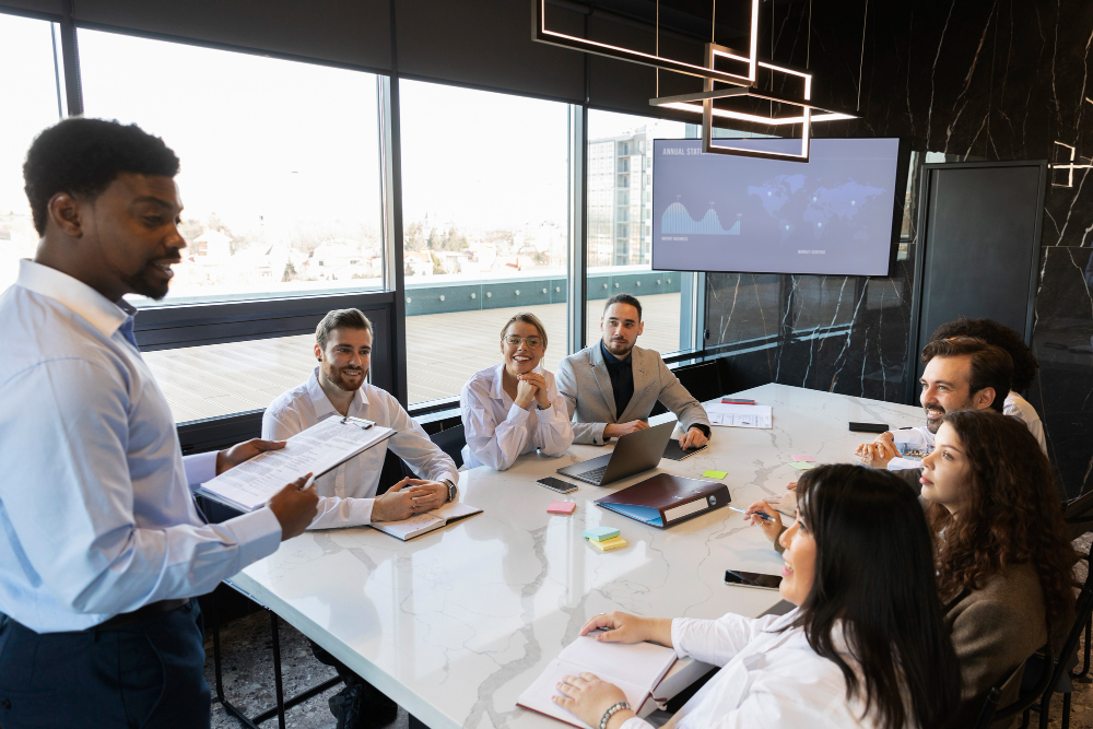 People having a meeting, one person is leading it