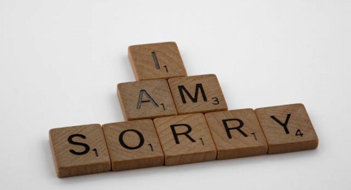 Say the right words at the right time! Scrabble Tiles on White Surface
