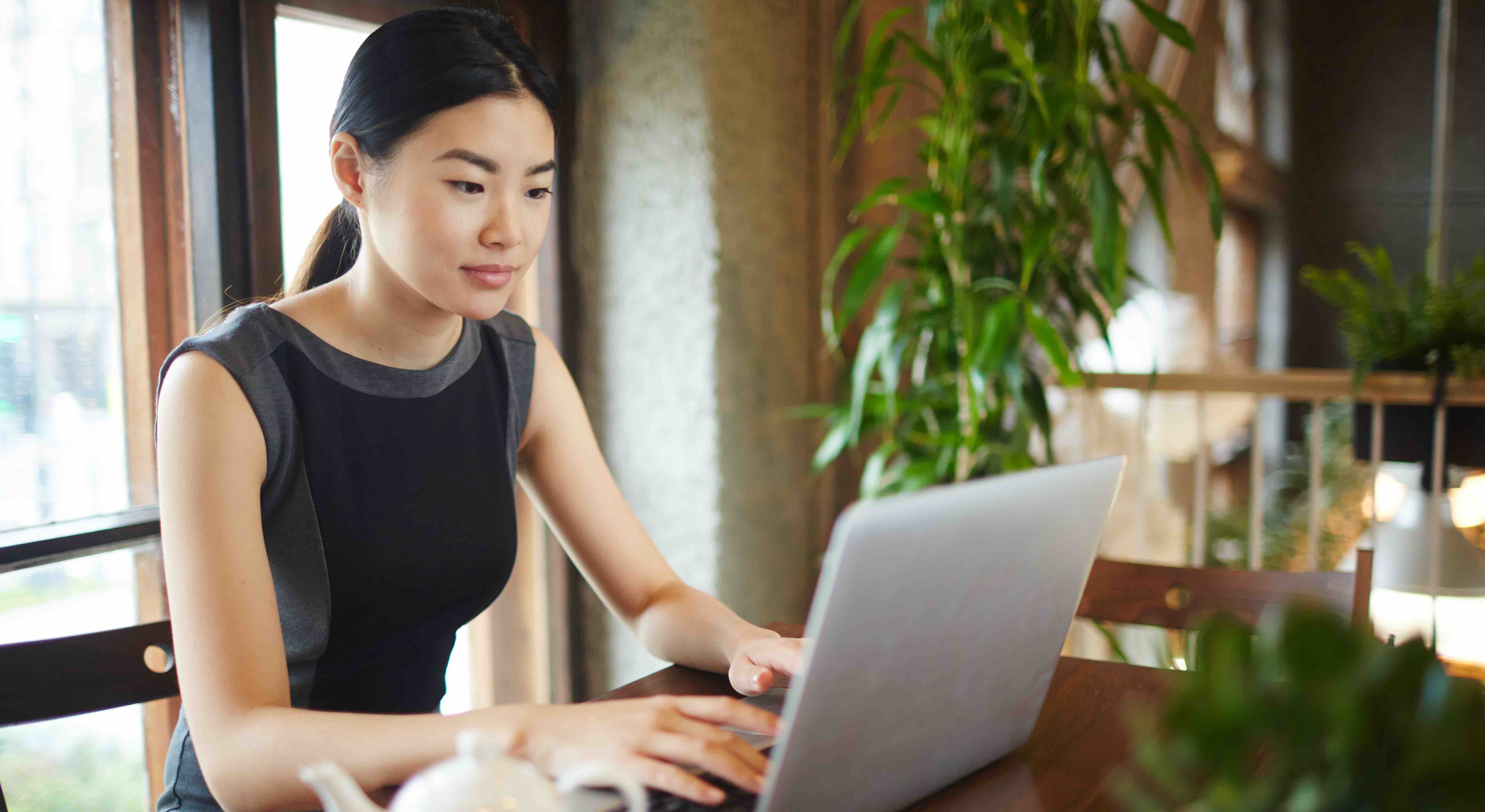 Woman working on a computer in a home office