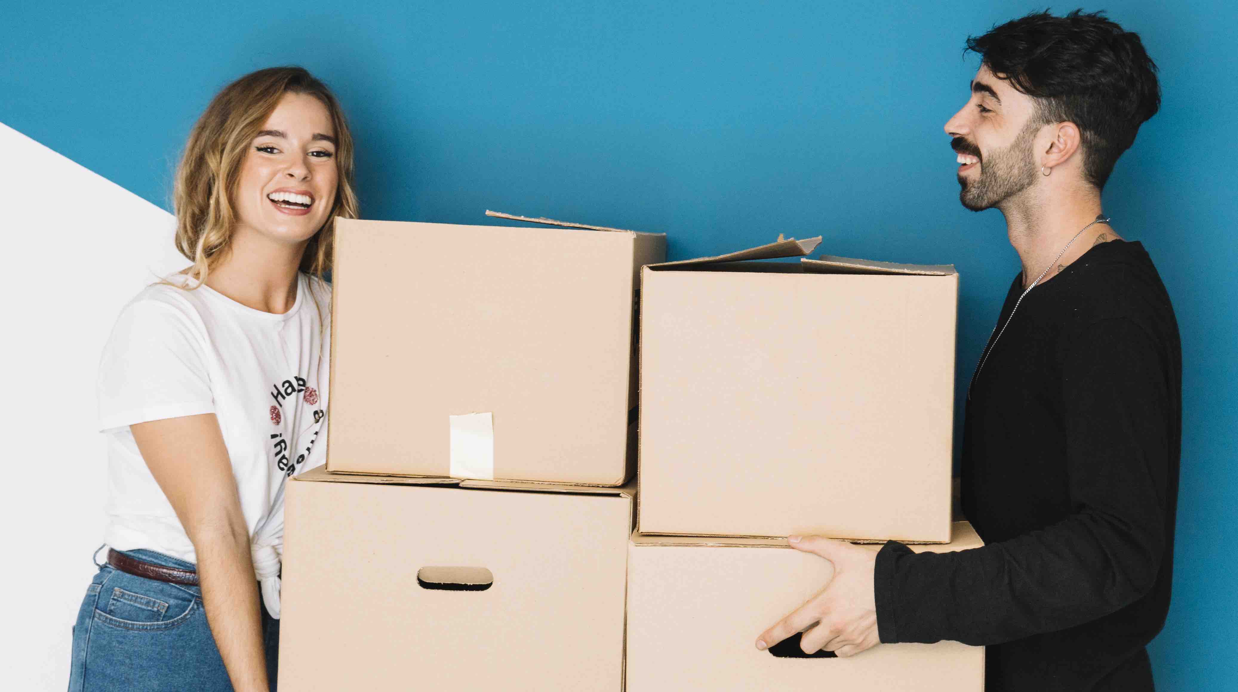 A young couple moving to new flat