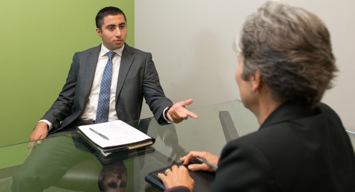 two business people talking across a table