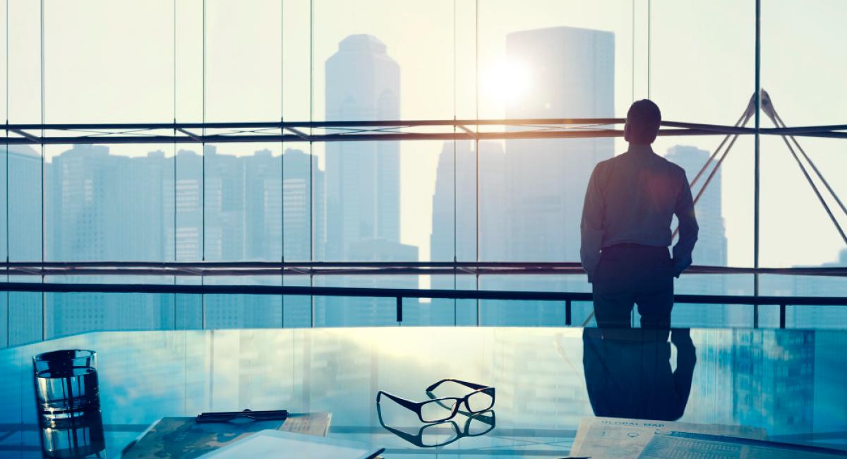 A businessman in a big office